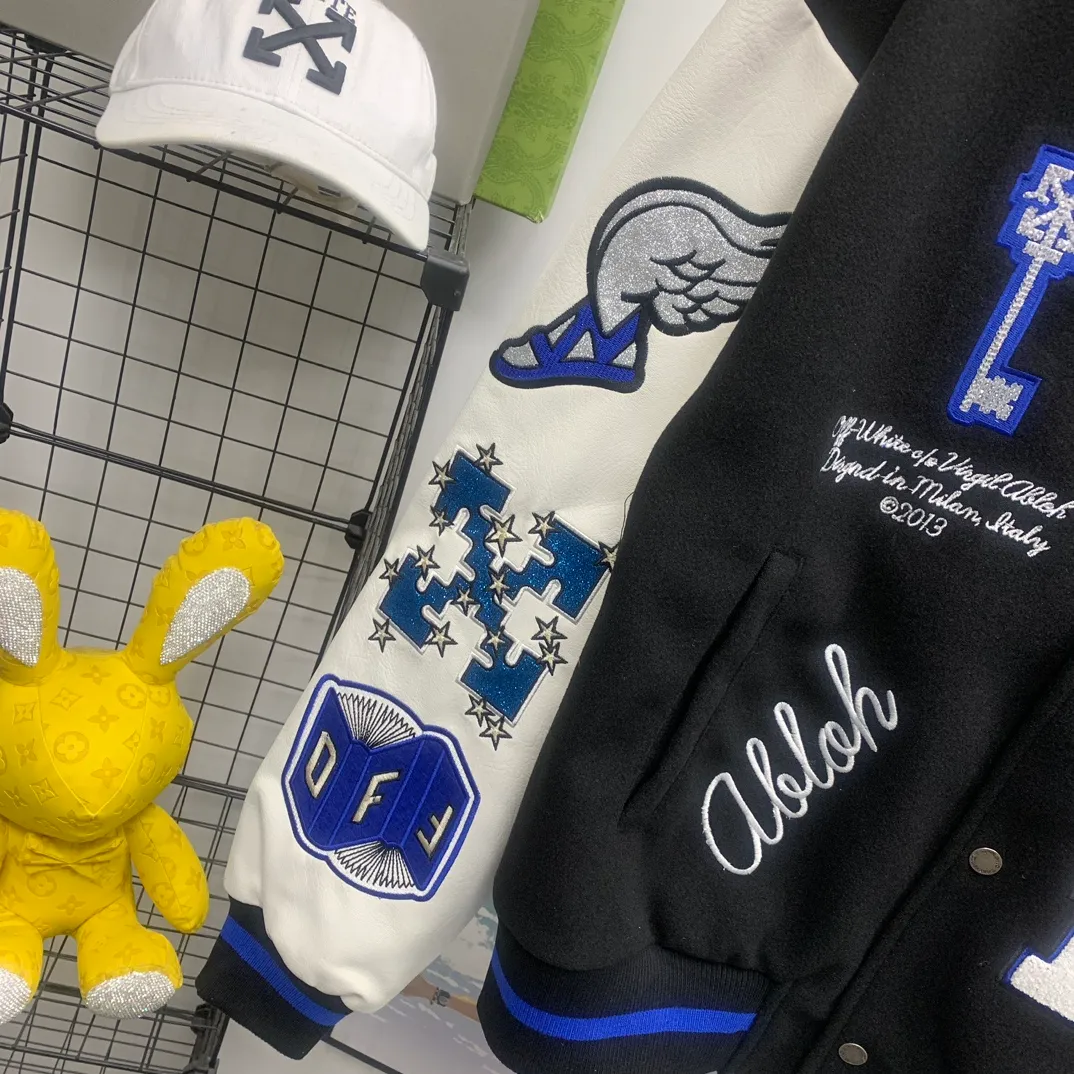 Top tested version 2023 off white heavy industry embroidery patchwork leather high temperature hot crystal diamond baseball uniform male and female couple star same style (⚠ original button mold customization, patch embroidery color matching) original packaging original label 🔍 full set of accessories customization packaging elevators are purchased from the original factory all hardware parts mold customization one-to-one restoration of fabric color components The fabric is made of 65% wool, 15% natural silk, 10% spandex and 10% velvet, mixed and custom-woven. The total weight is more than 900 grams! And the most important thing is its color fastness, it will never fade! -The embroidery uses an imported towel embroidery machine. Each pattern is first embroidered on the fabric, and then engraved with an infrared laser, and then fixed with a sewing machine. The whole garment is labeled in many places, one is flat embroidered, and the large pattern on the back is directly embroidered on it. This dress has 4 different embroidery techniques⚠ -The sleeves are all made of two-layer pebbled fabric, which is processed, shaped, colored, washed, and the texture retains the original grain structure! Thick, plump and round! -The processing technology is extremely complex, the cutting pieces are neatly aligned, and the entire garment has precise wiring density. Gender-neutral style. Loose fit, self-conscious quality control, details determine success or failure. Color: Black Size: S M L XL P: 680